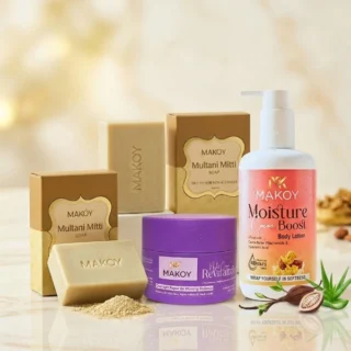 Makoy skincare combo pack featuring two Multani Mitti soaps, a Revitalizing Night Cream, and Moisture Cocoa Boost Body Lotion on a marble surface.